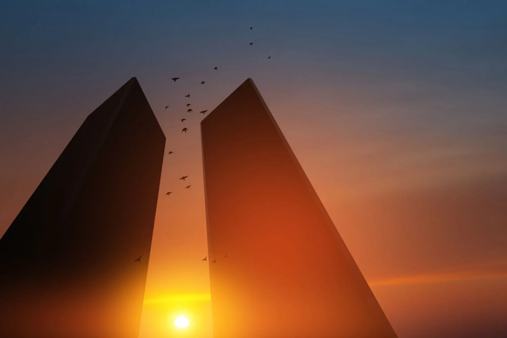 Sunset between two tall towers with birds